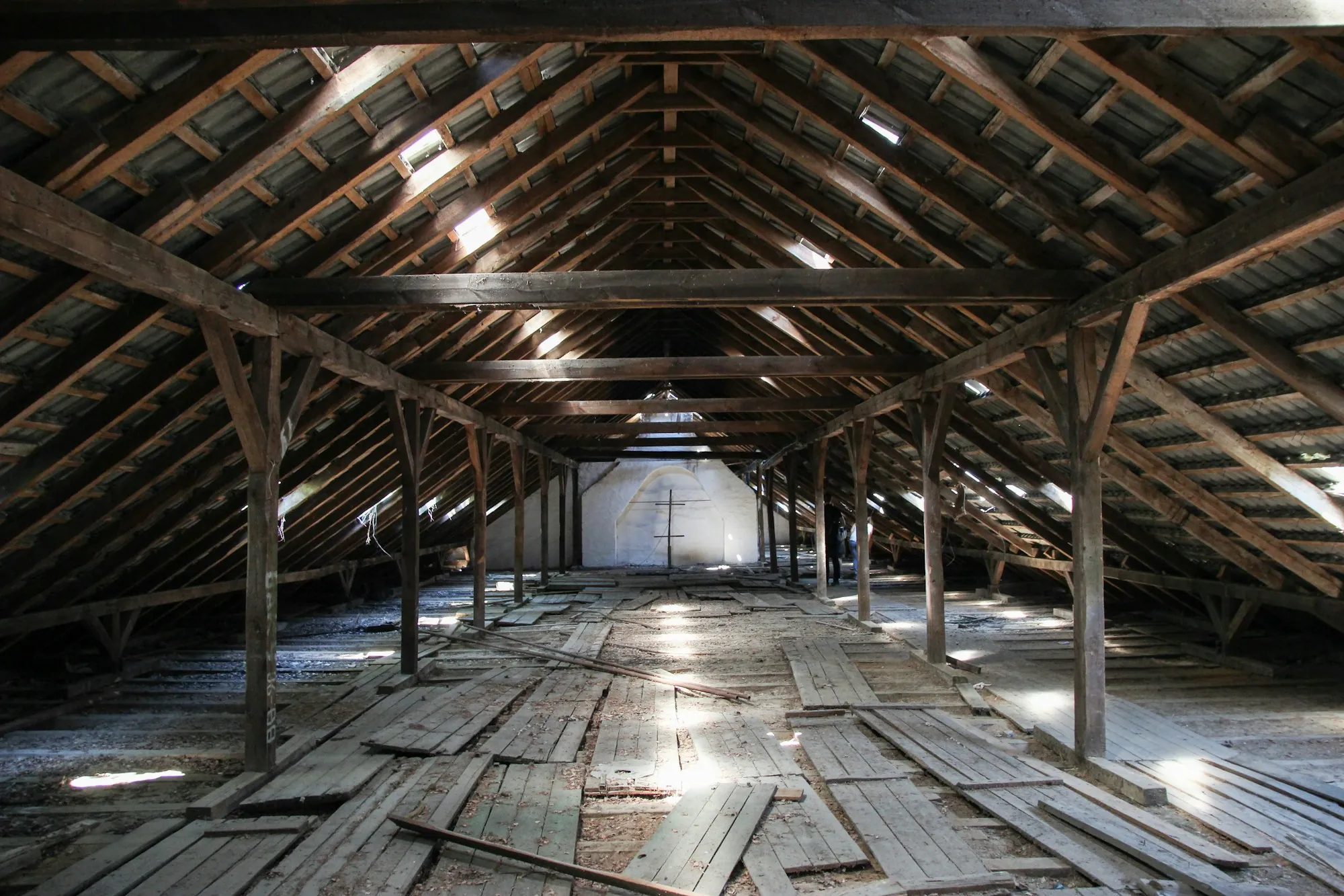 Long empty attic under exposed wood rafters