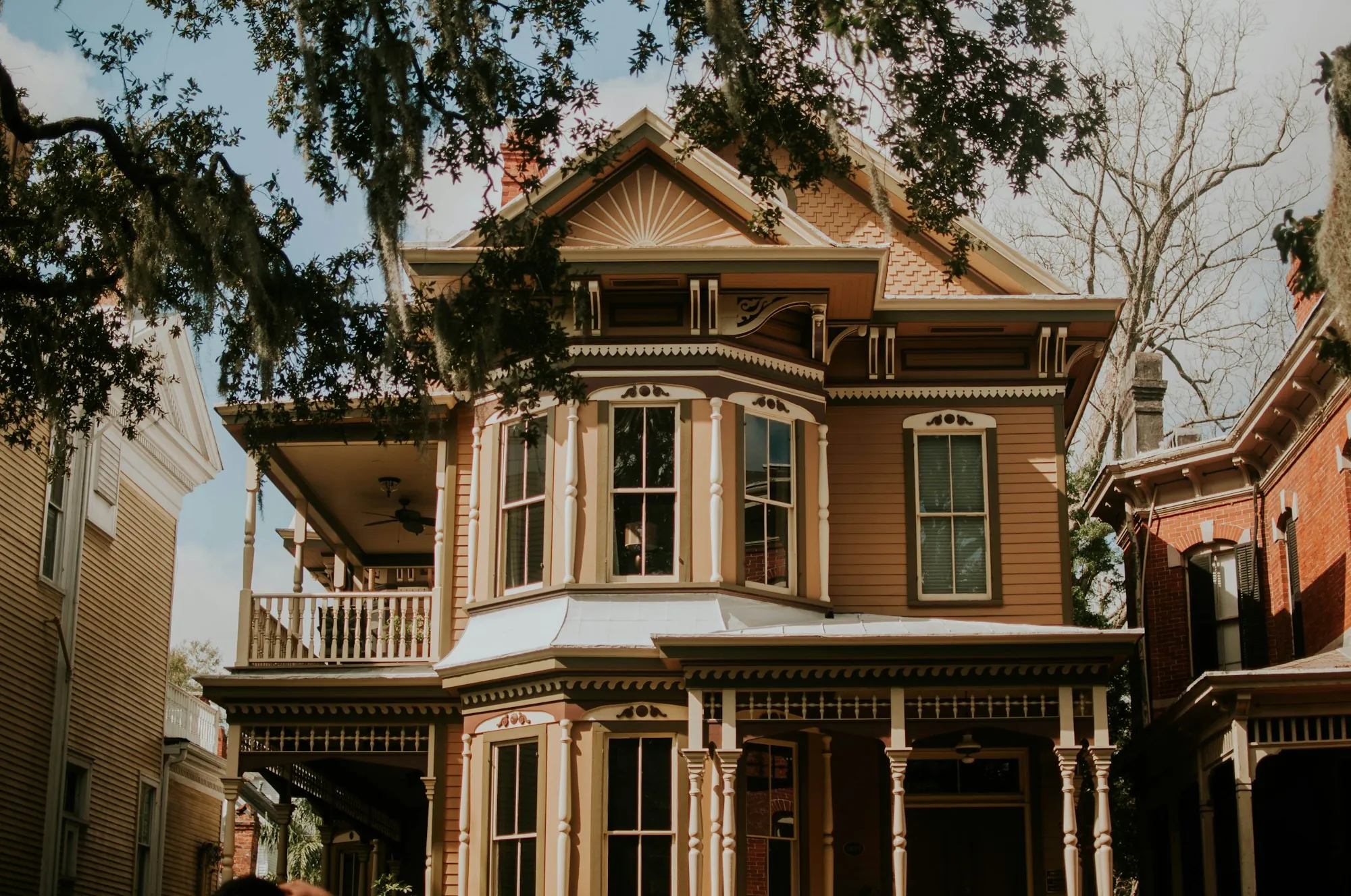 Victorian house with ornate trim and a balcony
