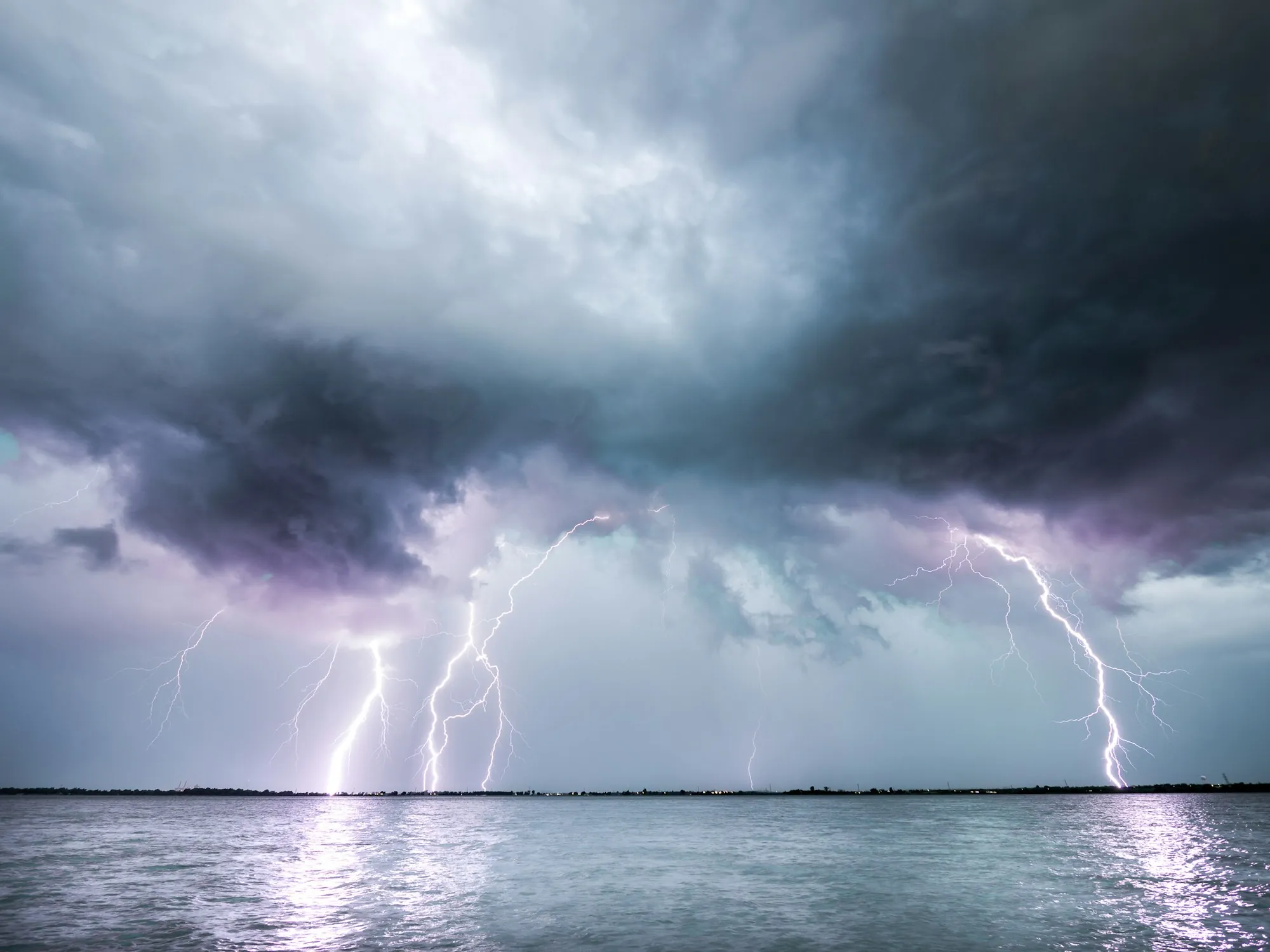 Several lightning bolts striking from a stormy sky